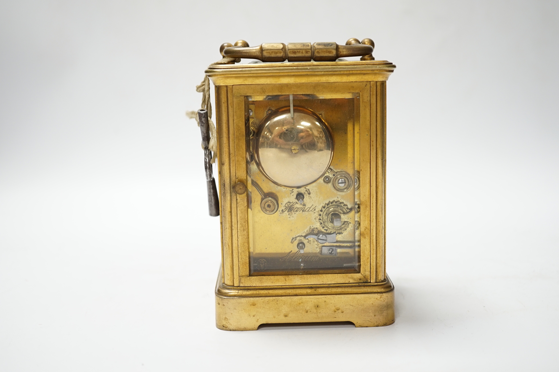 A brass carriage clock with subsidiary dial, 16cm high